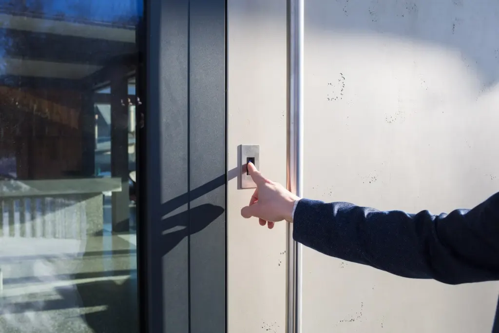 Biometric attendance tracking software in use upon door entry to building